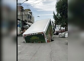 soda truck engulfed by huge hole in mexico city