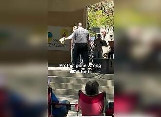 A woman takes to the stage to protest, but is confronted by a man for whom violence is natural