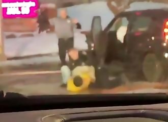 A drunk illegal immigrant is thrown to the ground by a policeman