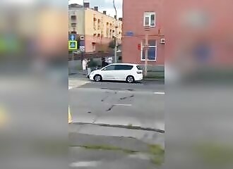 Angry wife puts husband on hood (until collision)