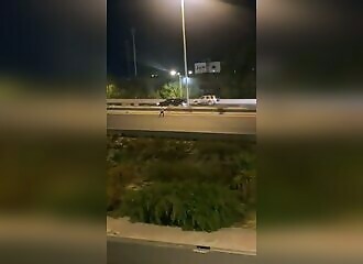 He is mowed down on the freeway while trying to stop other vehicles (Warning - shocking)