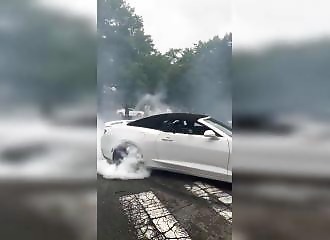 He narrowly escapes a car during a sideshow