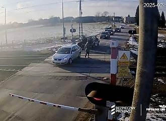 In extremis, a car stranded on a railroad track in Poland is rescued