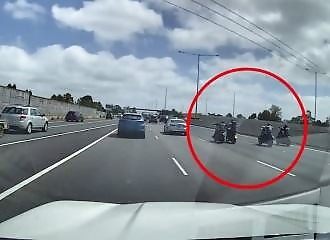 Motorcyclists hit another motorcyclist on a busy freeway