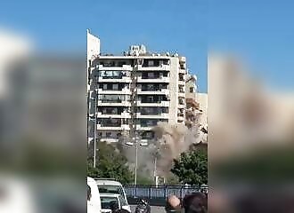 Lebanese building collapses immediately after being hit by Israeli bombardment