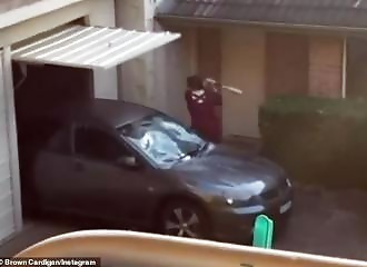 Neighbor smashes vintage car with baseball bat