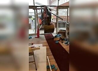 He thinks he hasn't been paid, and destroys a hotel with a backhoe