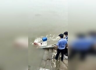 Two unmotivated policemen fail to save a man in a river