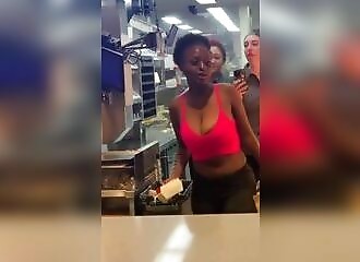 Angry customer enters the kitchen of a McDonald's to make her hamburger