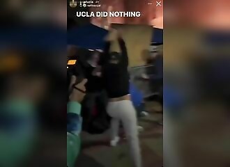 A pro-Israeli smashes a pro-Palestinian with a wooden beam