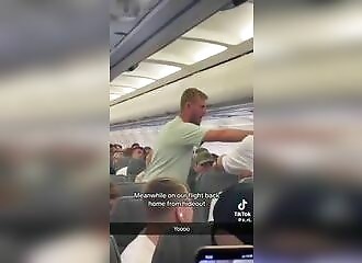 Crowd stops crazed passenger trying to open plane doors mid-flight