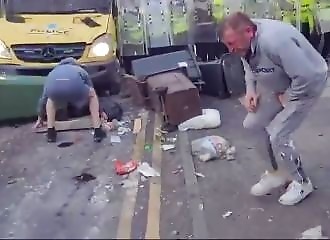A rioter is destroyed by bricks thrown by his own camp