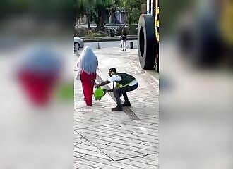 This guy blowing wigs in the street is certainly the funniest video of the day