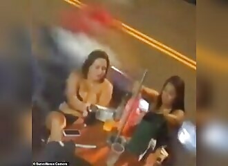  A woman sitting at a bar in Brazil is hit by a motorcyclist 