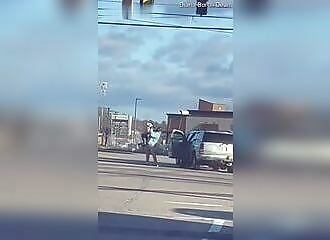 Brute lifts and throws a mother to the pavement after an accident