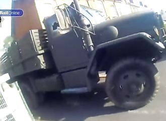 A former soldier causes chaos in a village with his military truck