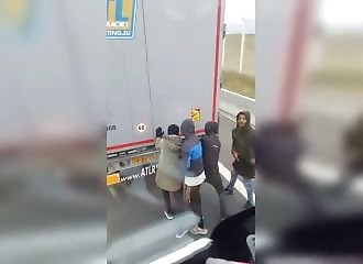 He films migrants getting into a truck but is attacked