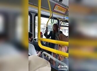 Man throws racist woman off bus after she spits at him
