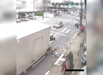 A homeless man pushes a passer-by on the road for no reason (he almost gets run over)