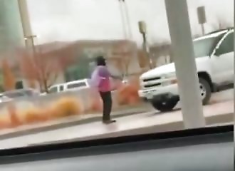 A protester tries to block a car, which ends badly for him
