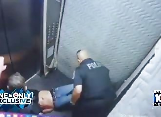 He calls the police, gets shot, and dragged into the elevator (Warning - shocking)