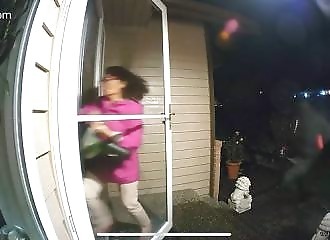 An Asian woman is chased to her front door but locks it in extremis