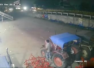 A tractor that seems possessed runs over a man (Warning - shocking)